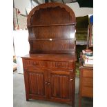 A domed top oak dresser.