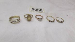 Five 9ct gold rings (total weight with stones 9.3 grams).