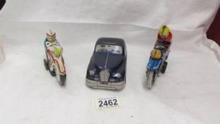 A tinplate Mettoy police car and Western Germany and Spanish motor cycles.