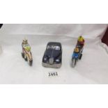 A tinplate Mettoy police car and Western Germany and Spanish motor cycles.