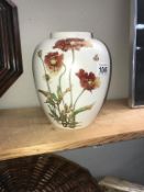 A Poole pottery floral vase ****Condition report**** No cracks or chips. Height 21.