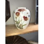 A Poole pottery floral vase ****Condition report**** No cracks or chips. Height 21.