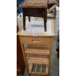 A pine kitchen unit and a pine stool.