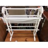 A white painted wooden bathroom towel rail