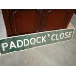A Paddock Close sign.
