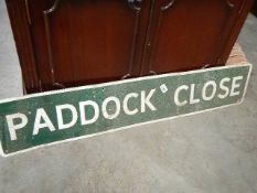 A Paddock Close sign.