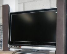 A JVC TV and a pair of speakers.