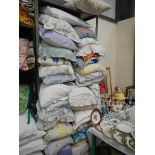 A large quantity of pillows in pillowcases.