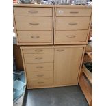 A cupboard and two matching three drawer chests.
