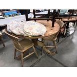 A round solid pine dining table (top not fixed) & 2 chairs with 7 cushions (table diameter 122cm x