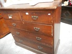 A two over three chest of drawers.