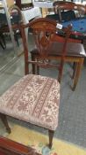 An Edwardian mahogany inlaid bedroom chair.