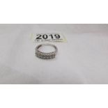 A diamond double row band ring set with 16 diamonds in 9ct white gold, size O.