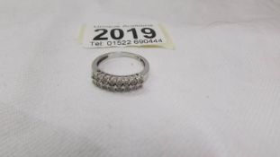 A diamond double row band ring set with 16 diamonds in 9ct white gold, size O.