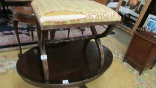 An old stool in need of recovering,