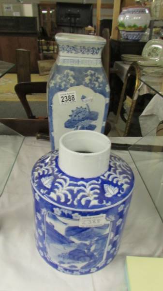A blue and white vase and a blue and white jar, missing lid.