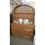 A superb quality light oak arched top dresser.