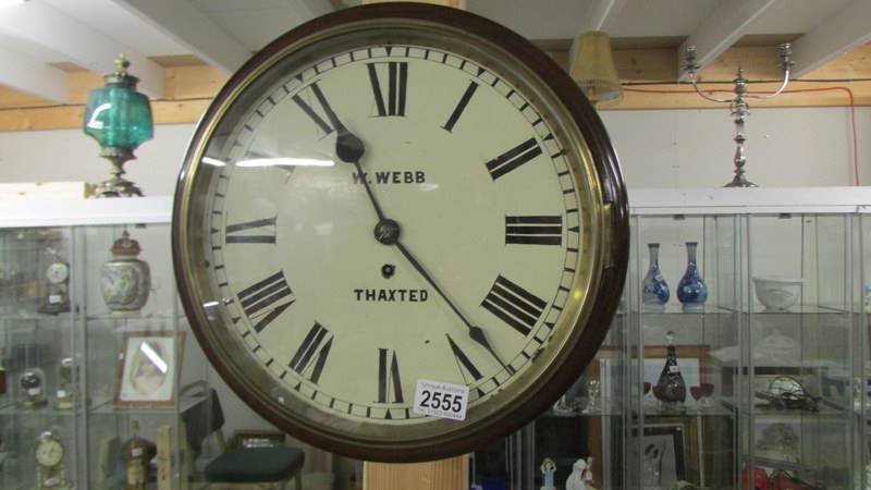 A circular wall clock - W Webb, Thaxstead.