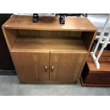 A teak veneered 2 door cupboard