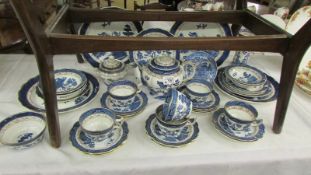In excess of 30 pieces of Booth's 'Real Old Willow' blue and white tableware.