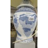 A blue and white Chinese table lamp with shade.
