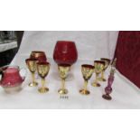 A set of 6 Bohemian gold decorated glasses and other red glass.
