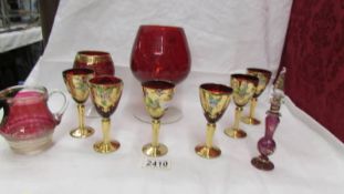 A set of 6 Bohemian gold decorated glasses and other red glass.