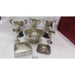 A collection of five silver trophies and prizes and three silver plate trophies including awarded