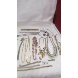 A mixed lot of necklaces, bracelets etc.