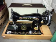 A Gold Leaf sewing machine (cover does not match it is just used to protect the machine)(Collect
