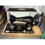 A Gold Leaf sewing machine (cover does not match it is just used to protect the machine)(Collect