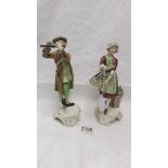 A pair of Goebel figurines.