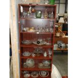 Seven shelves of glass ware.