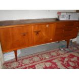 A teak sideboard.