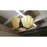 An art deco four amber clam shell uplighter ceiling light.