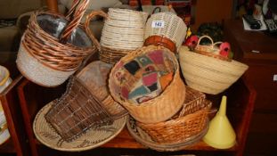 Two shelves of wicker pots etc.