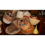 Two shelves of wicker pots etc.