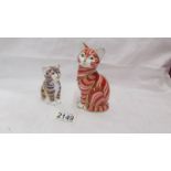 Two Royal Crown Derby cat paperweights both with gold stoppers.