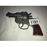 A vintage Crescent toy cap gun