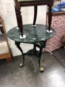 A marble top pub table with cast iron base (diameter 76cm x 75cm high)