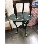 A marble top pub table with cast iron base (diameter 76cm x 75cm high)