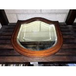 An Edwardian inlaid mahogany bevel edge shield shaped wall mirror (31.