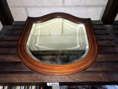 An Edwardian inlaid mahogany bevel edge shield shaped wall mirror (31.