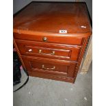 A mahogany 2 drawer chest.