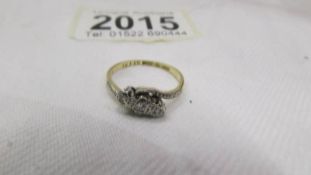 A circa 1940 diamond ring in a three stone design, platinum set, 18ct gold shank, stamped 18ct/Plat.