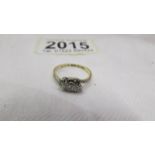 A circa 1940 diamond ring in a three stone design, platinum set, 18ct gold shank, stamped 18ct/Plat.