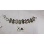 A multi stone set bracelet in silver, rose quartz, agate etc.