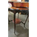 A mahogany occasional table.