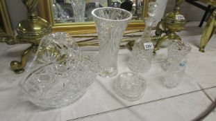 Three cut glass vases, a cut glass decanter, a cut glass rose basket and a cut glass powder bowl.