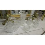 Three cut glass vases, a cut glass decanter, a cut glass rose basket and a cut glass powder bowl.